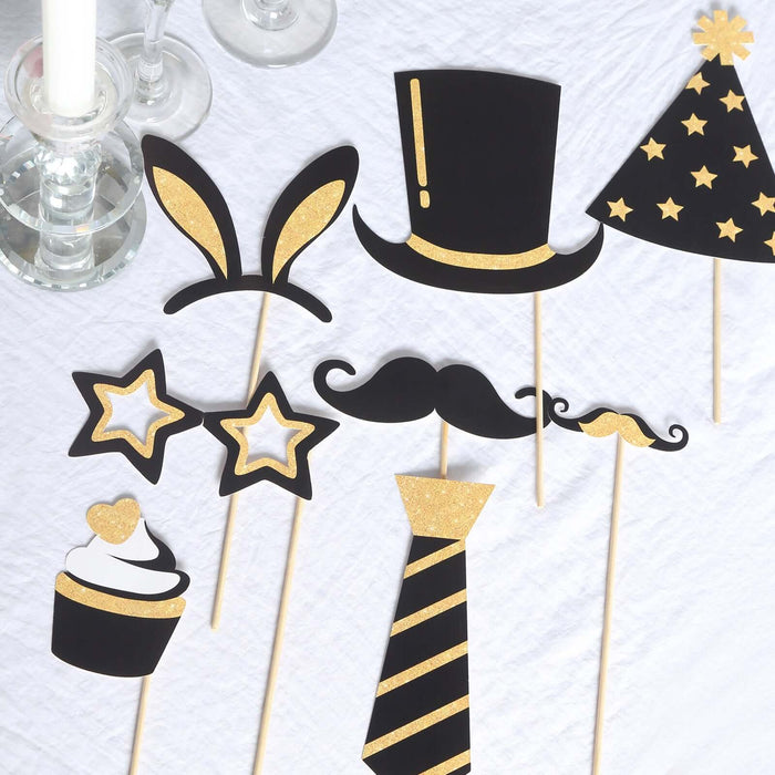 Party photo booth props including hats, mustaches, and stars on a table.