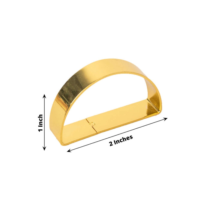 Gold metal napkin ring holder, 2 inches wide and 1 inch tall.