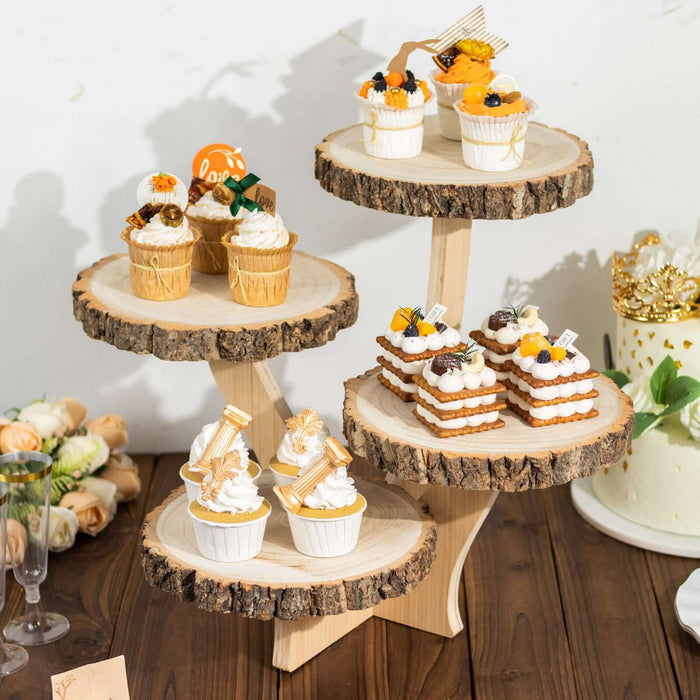 Decorative dessert display with cupcakes and treats on wooden stands.