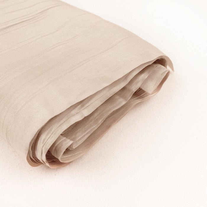 Beige fabric roll on a plain background
