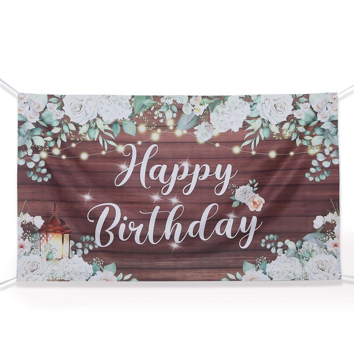 Happy Birthday banner with floral design on wood background.