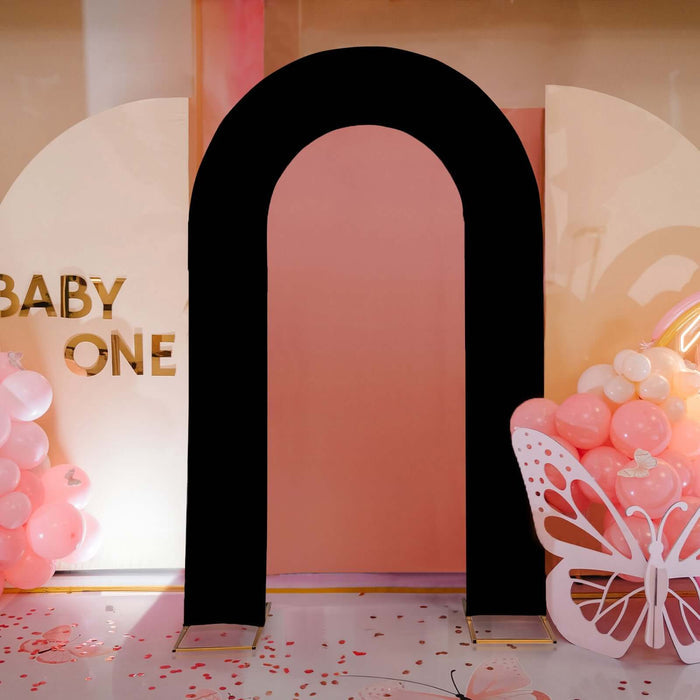Black arch backdrop for baby shower decoration.