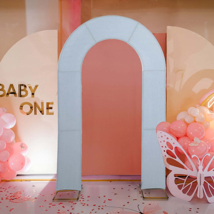 Archway decoration for baby event with pink balloons and butterfly accents.