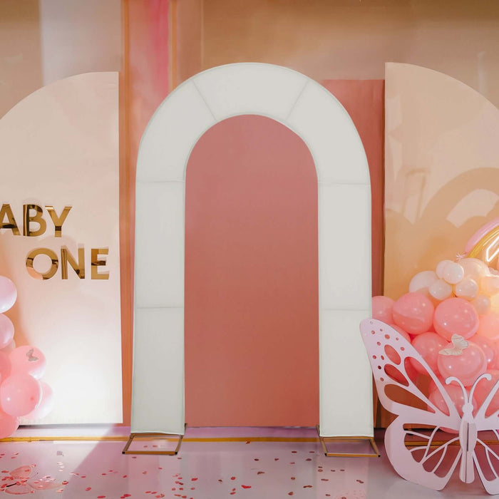 White arch backdrop for baby shower theme decor.