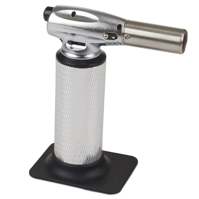 Butane torch with metal nozzle on a white background