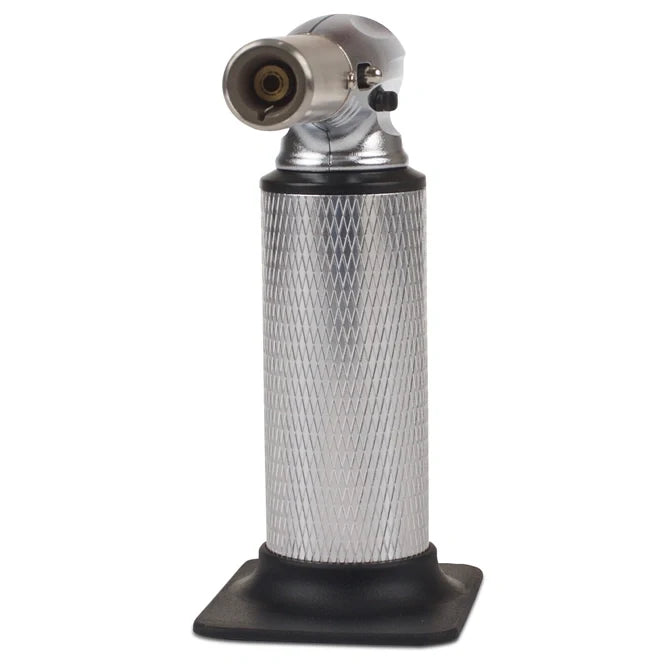 Butane torch with metallic nozzle and textured black base on a white background