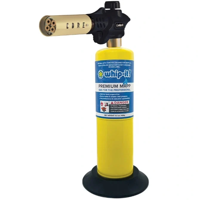 A black Core Pro Torch with a yellow gas cylinder attached to a black base, designed for grilling and cooking.