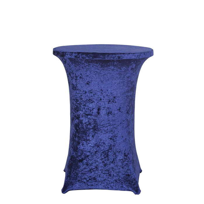 Round blue velvet table cover on a plain backdrop