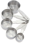 A set of five stainless steel dry measure cups of different sizes, each with a handle and marked with measurements.