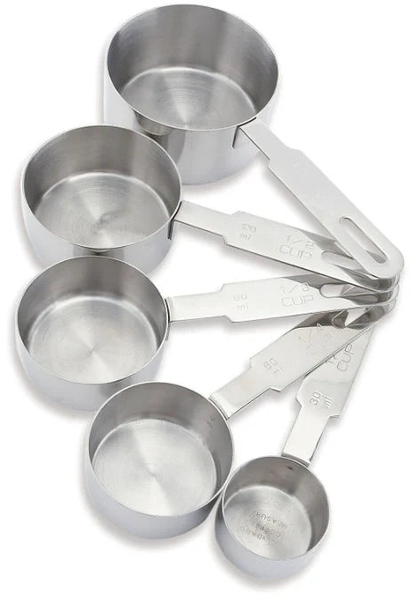 A set of five stainless steel dry measure cups of different sizes, each with a handle and marked with measurements.
