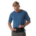 Man wearing Black Eagle Creek Stash RFID Sling Bag around waist with cash