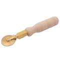 A professional brass pasta wheel with a smooth finish, featuring a heavy-duty brass blade and a robust natural wood handle.