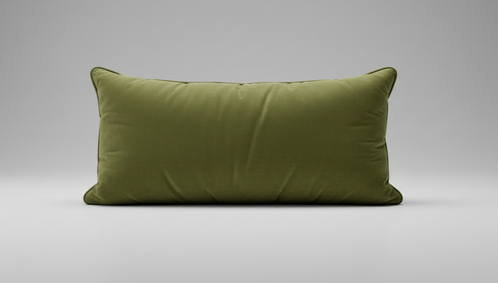 An olive green velvet lumbar pillow with a long rectangular shape and piped edges, shown against a plain white background.