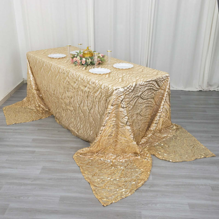 Gold sequin tablecloth draped elegantly on a table with floral centerpiece.
