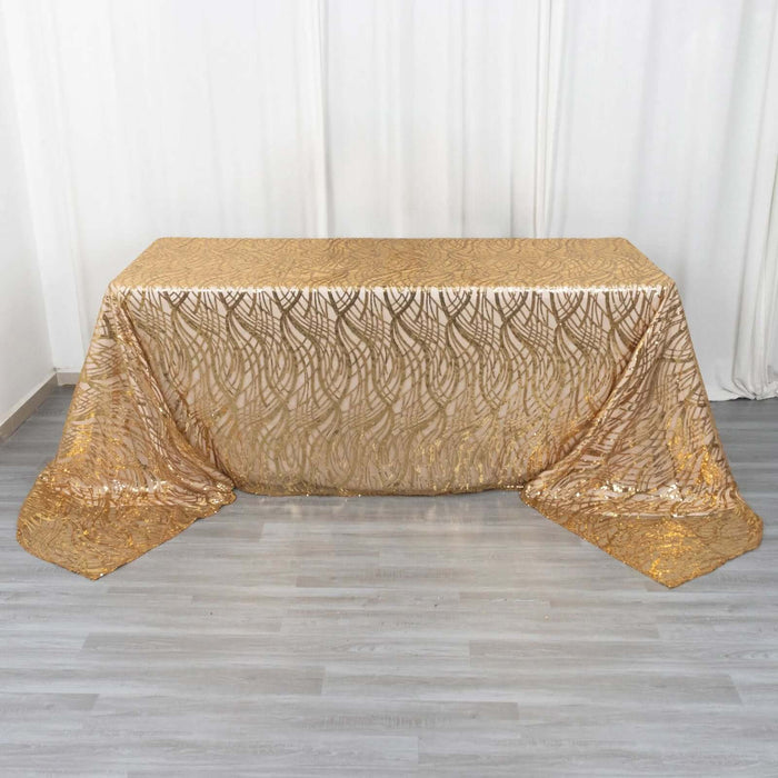 Gold patterned table cloth draped elegantly over a table.