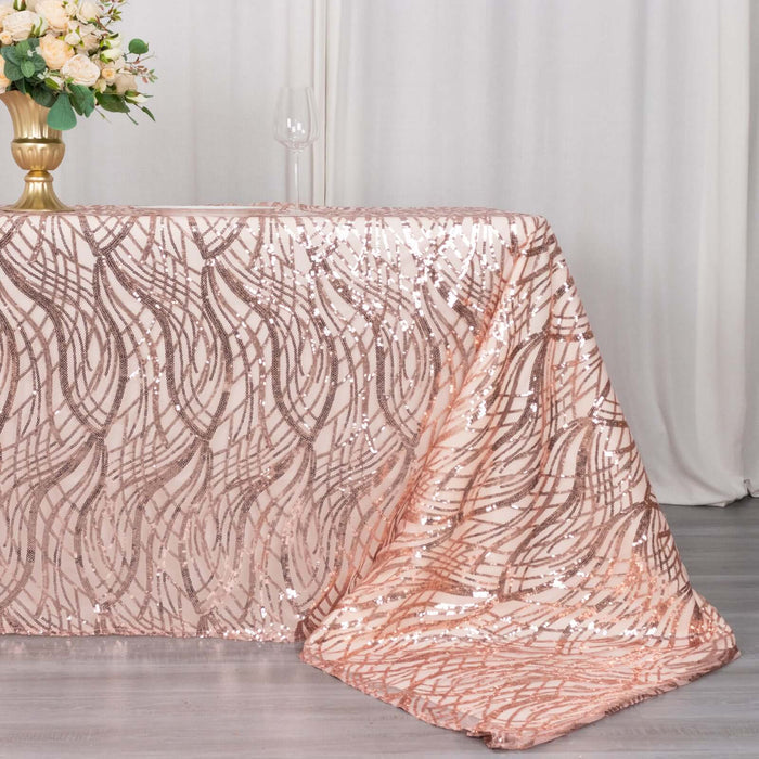 Rose gold sequin tablecloth draping elegantly over a table.