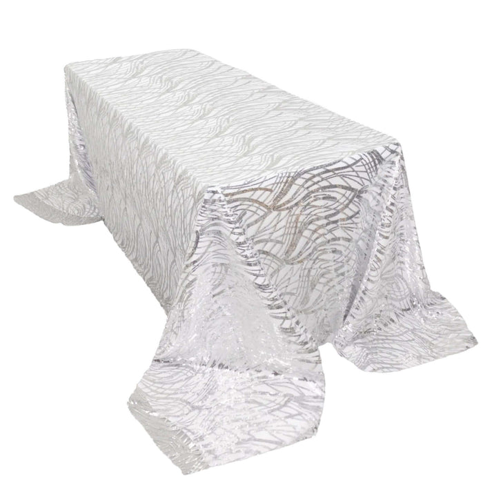 Silver patterned tablecloth on a rectangular table