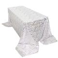 Silver patterned tablecloth on a rectangular table