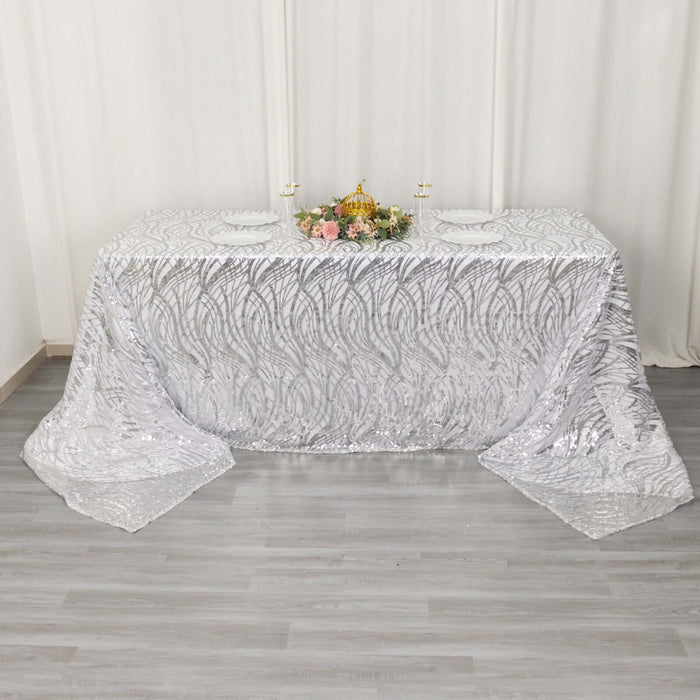 Elegant silver sequin tablecloth with intricate design for special events.