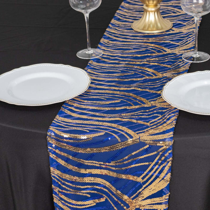 Blue and gold sequin table runner on a black table with plates and glasses.