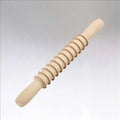 A beige wooden pasta cutter with a rolling pin shape, designed for cutting Pappardelle pasta.