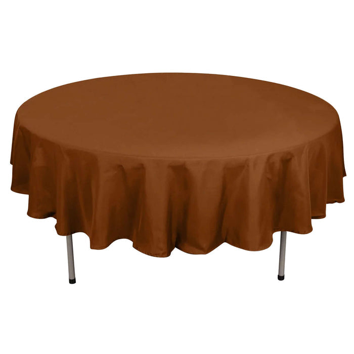 Brown round tablecloth on a plain backdrop