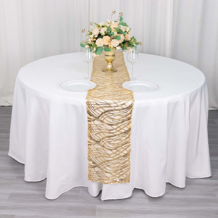 Elegant gold and white table runner on a round table with floral centerpiece.