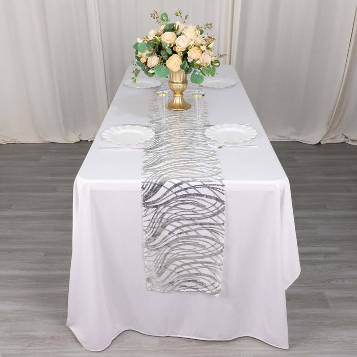 Elegant table setting with floral centerpiece and decorative table runner.
