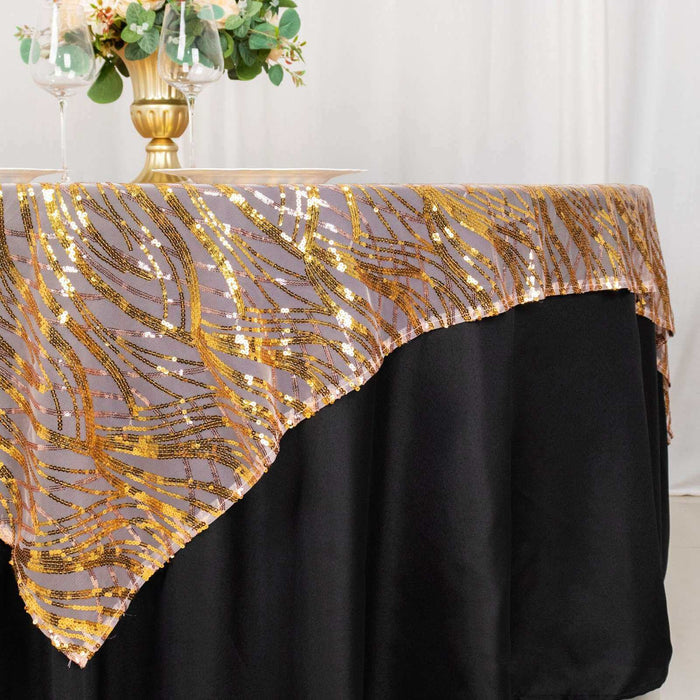 Elegant gold sequin tablecloth draping over a black table