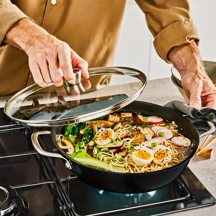 Tefal Excellence+ Induction FusionCore Non-Stick All-In-One Pan 28cm + Lid on stove top
