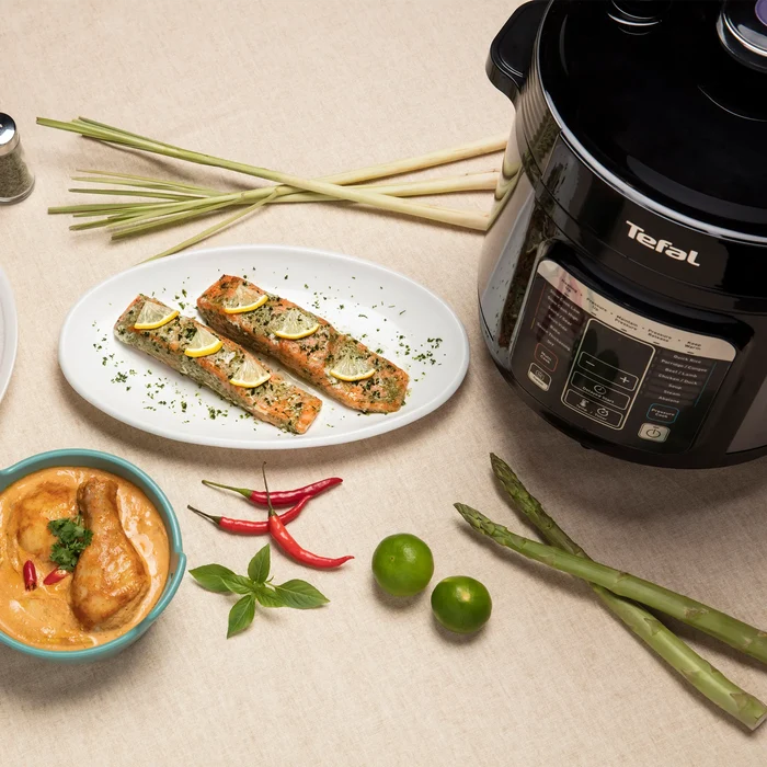 Tefal Home Chef Smart Multicooker CY601 Rice & Multicooker on kitchen counter with fish and chicken