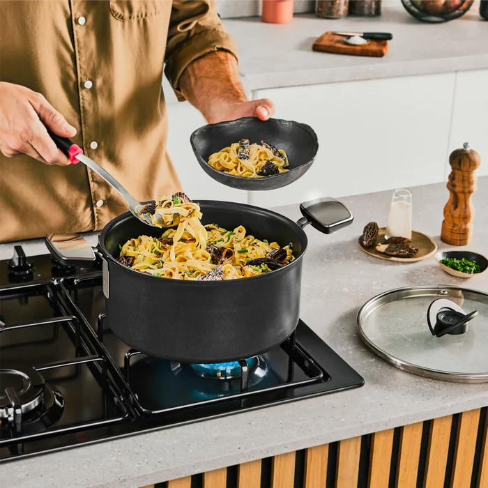 Tefal Space+ Excellence+ Induction Non-Stick Stewpot 24cm + Lid in use on gas stovetop